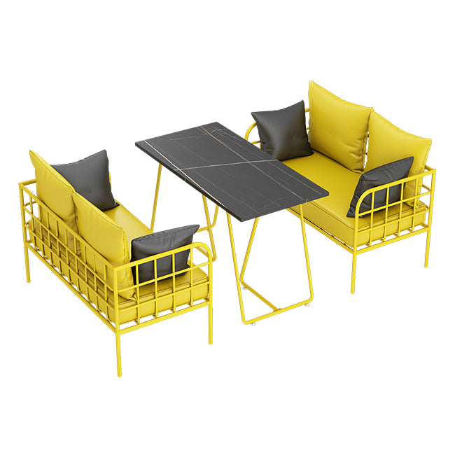 Mesa de cena de piedra sinterizada industrial mesa de mesa negra con marco amarillo para comedor