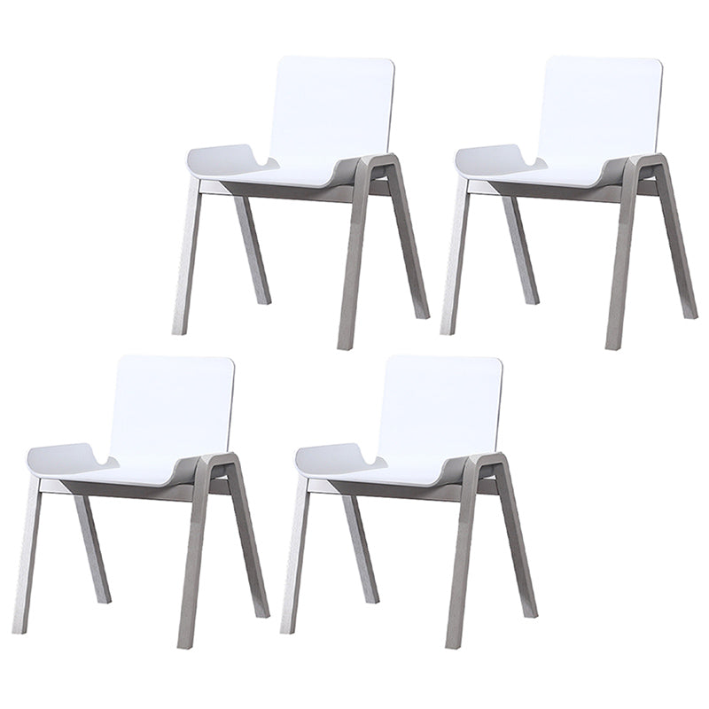 Sillón de comedor apilable escandinavo con respaldo macizo y patas de madera