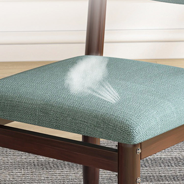 Silla lateral casera escandinava tapizada con respaldo abierto Silla de comedor individual de metal