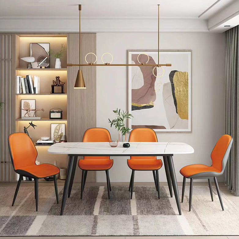 El comedor contemporáneo del metal preside el cuero que cena las sillas sin brazos para el uso en el hogar