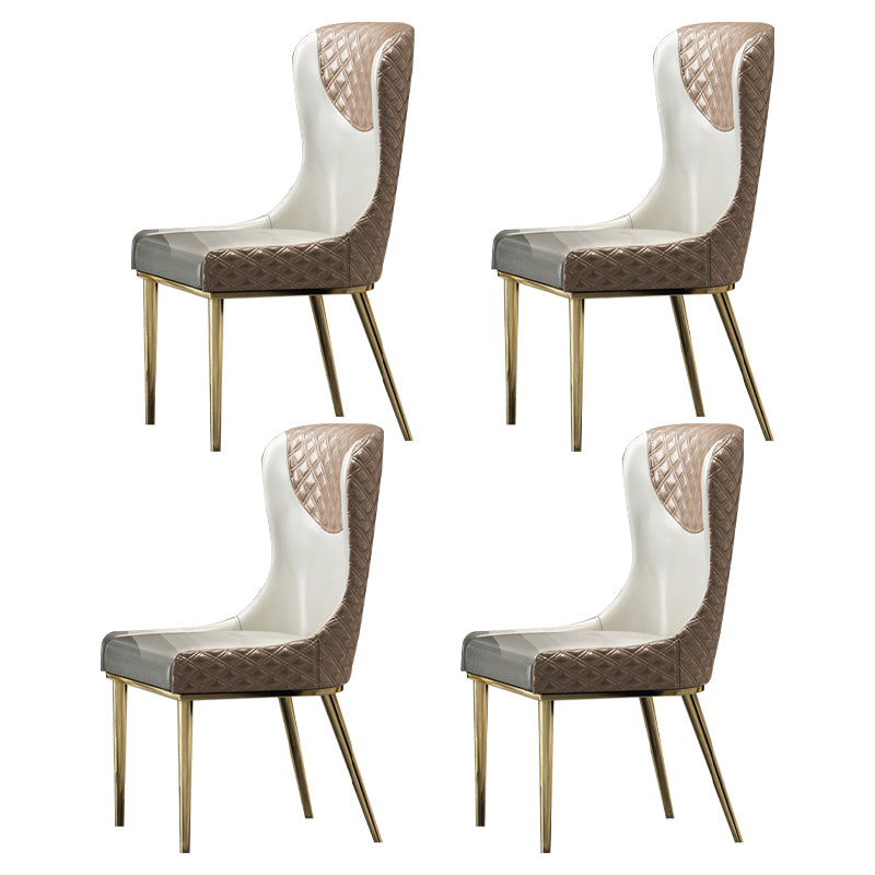 Silla sin brazos tapizada de cuero con respaldo lateral y patas de metal