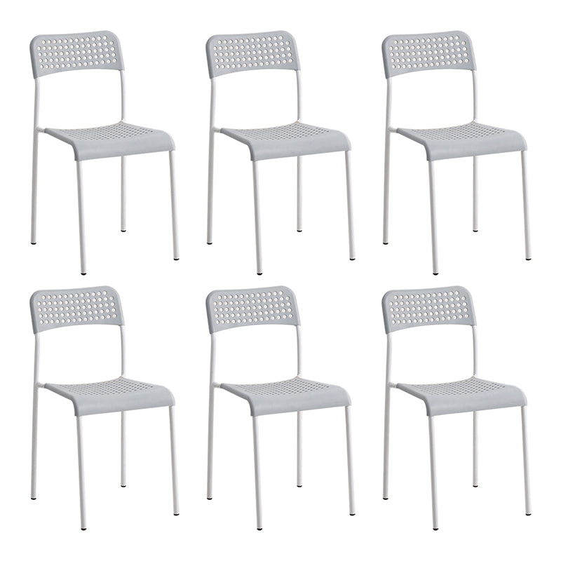 El comedor contemporáneo del metal preside la parte posterior abierta plástica que cena la silla sin brazos lateral