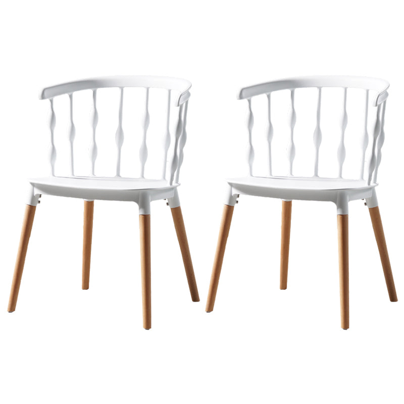 Sillas de comedor estilo moderno Sillas sin brazos de plástico con patas de madera