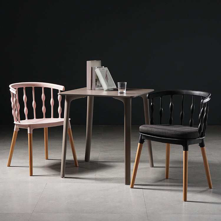 Sillas de comedor estilo moderno Sillas sin brazos de plástico con patas de madera