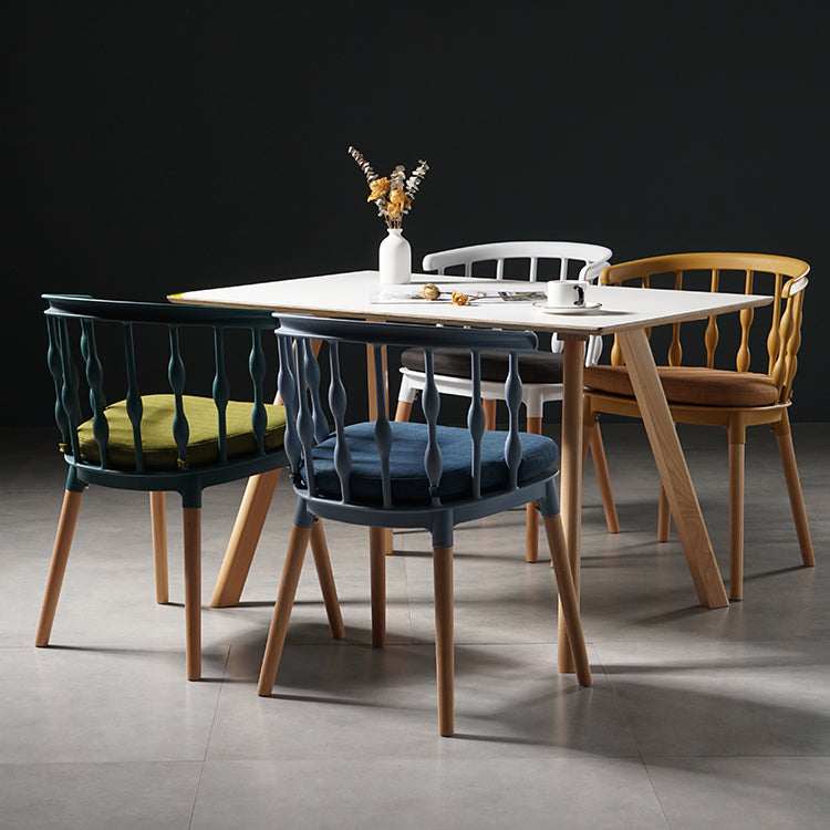 Sillas de comedor estilo moderno Sillas sin brazos de plástico con patas de madera