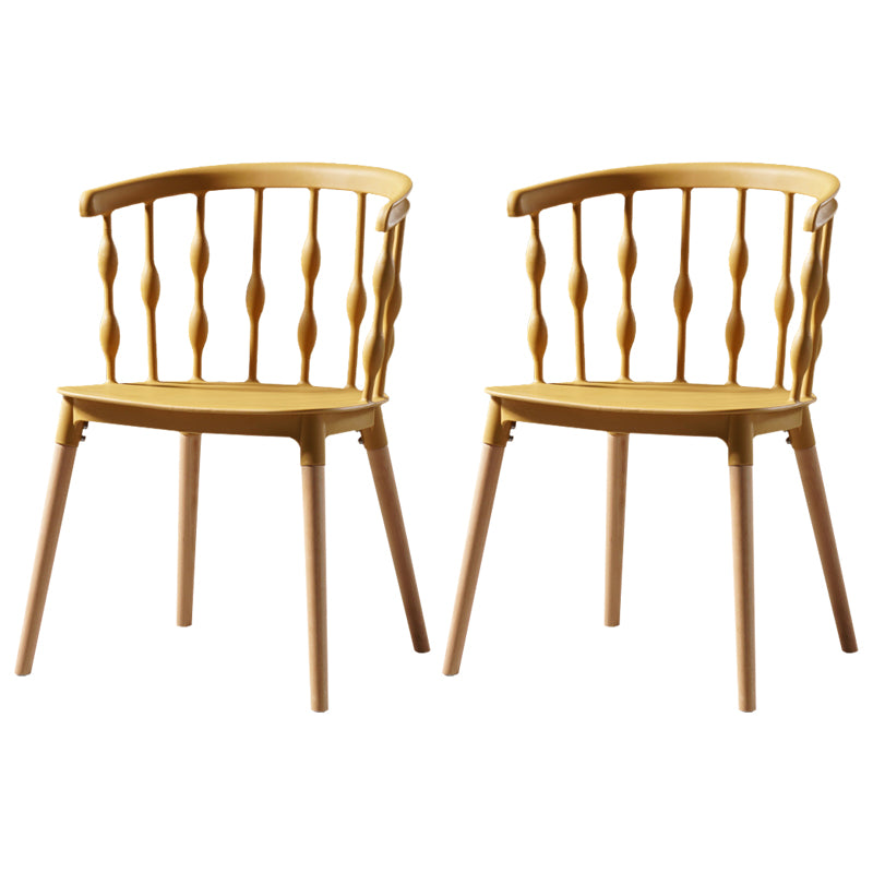 Sillas de comedor estilo moderno Sillas sin brazos de plástico con patas de madera