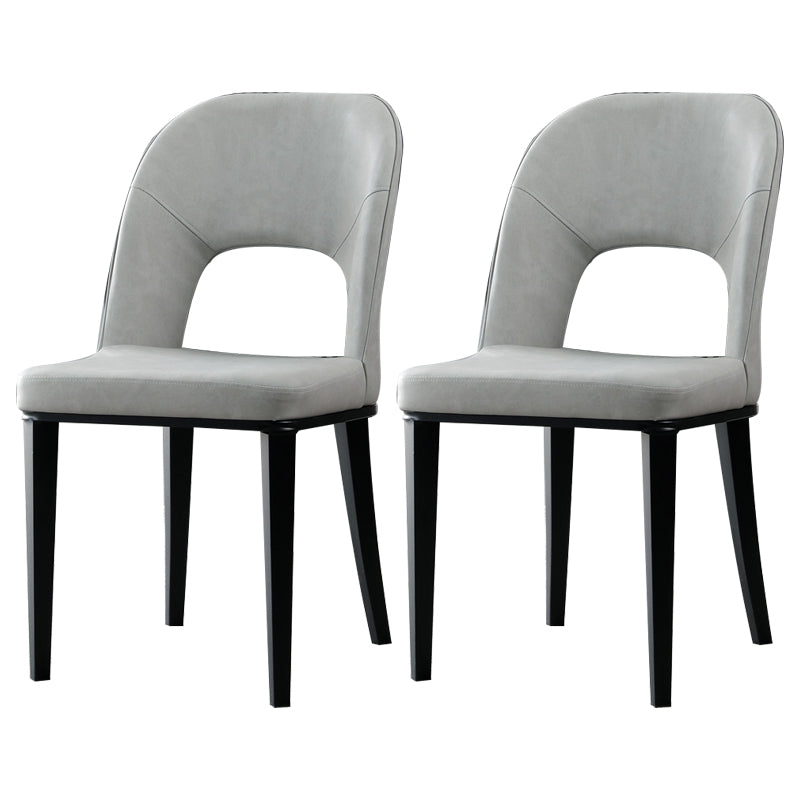 Silla de comedor contemporánea con acabado mate, respaldo abierto de cuero, silla lateral