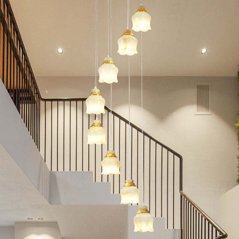 White Glass Floral Cluster Pendant Light Modernism 8 Lights Stair Hanging Lamp in Gold
