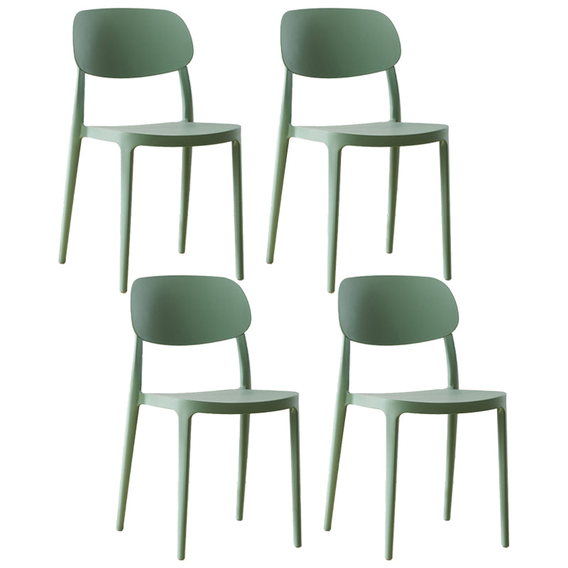 Silla lateral abierta apilable de cena sin brazos del plástico escandinavo de las sillas