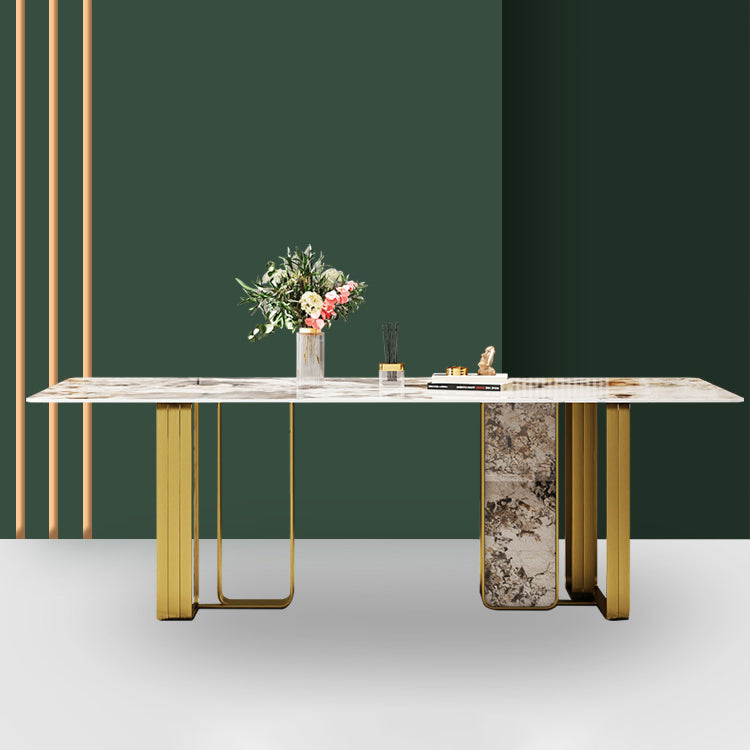 Mesa de comedor rectangular de piedra sinterizada de lujo con pedestal doble dorado