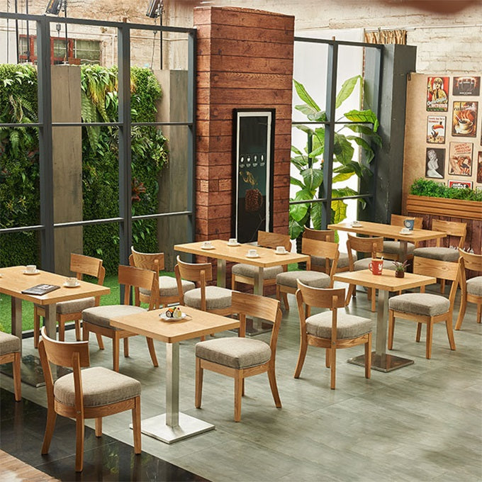 Mesa de comedor industrial de madera maciza con base de pedestal de metal