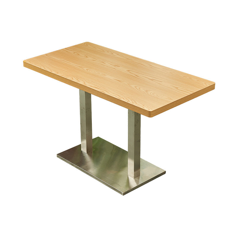 Mesa de comedor industrial de madera maciza con base de pedestal de metal