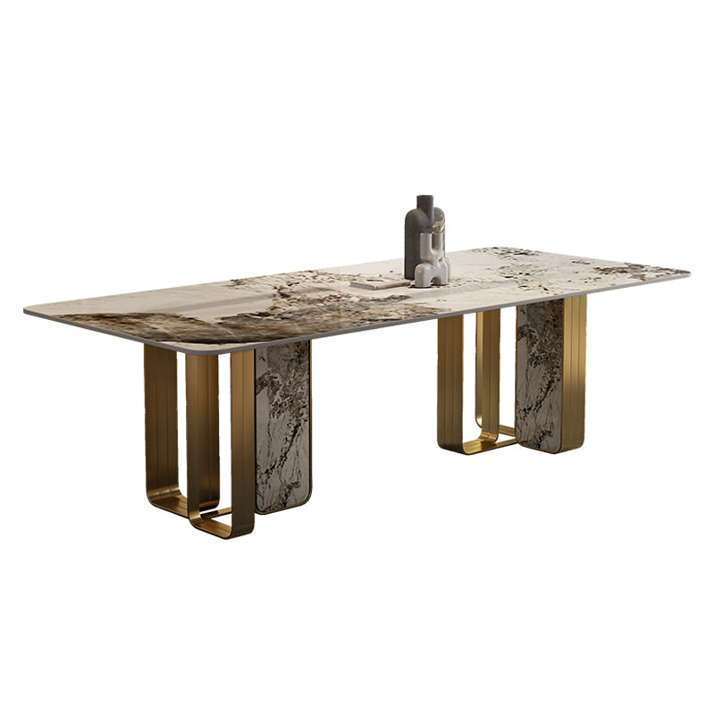 Mesa de comedor de piedra sinterizada de lujo con metal y piedra doble pedestal en oro