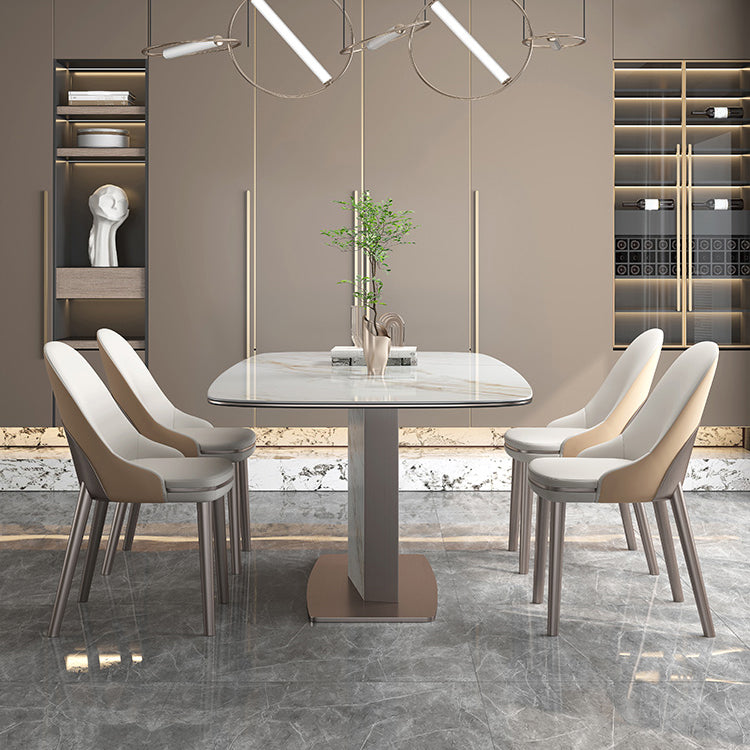 Mesa de comedor de piedra sinterizada de lujo con pedestal de metal en oro rosa
