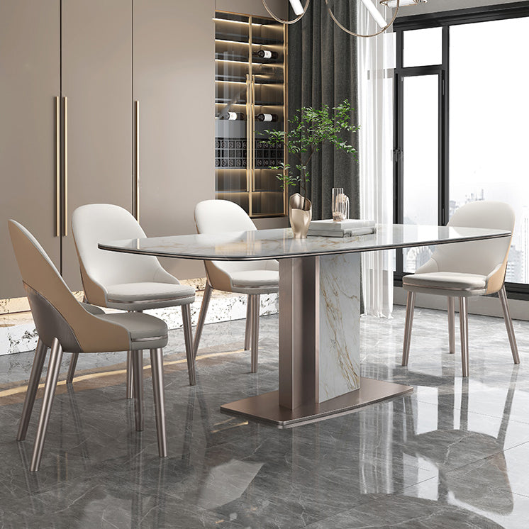 Mesa de comedor de piedra sinterizada de lujo con pedestal de metal en oro rosa