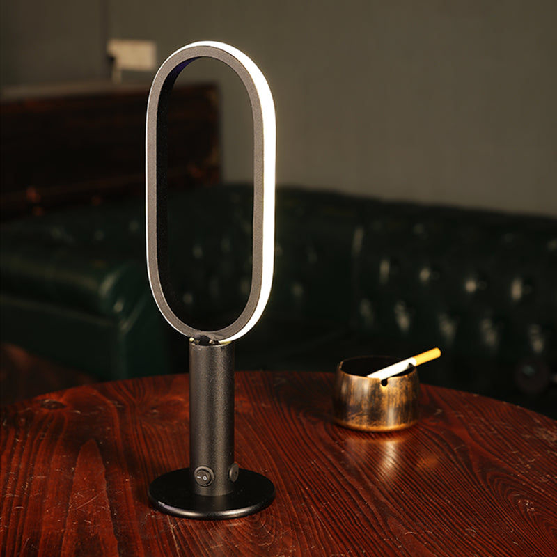 1 Light Oval Nightstand Lamp Contemporary Metal Nightstand Lamps for Club in Black