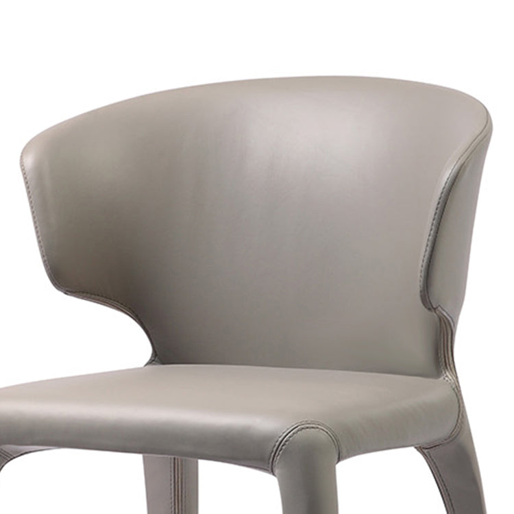 Silla de comedor individual con respaldo de ala y acabado mate de sillón de cuero estilo diseñador
