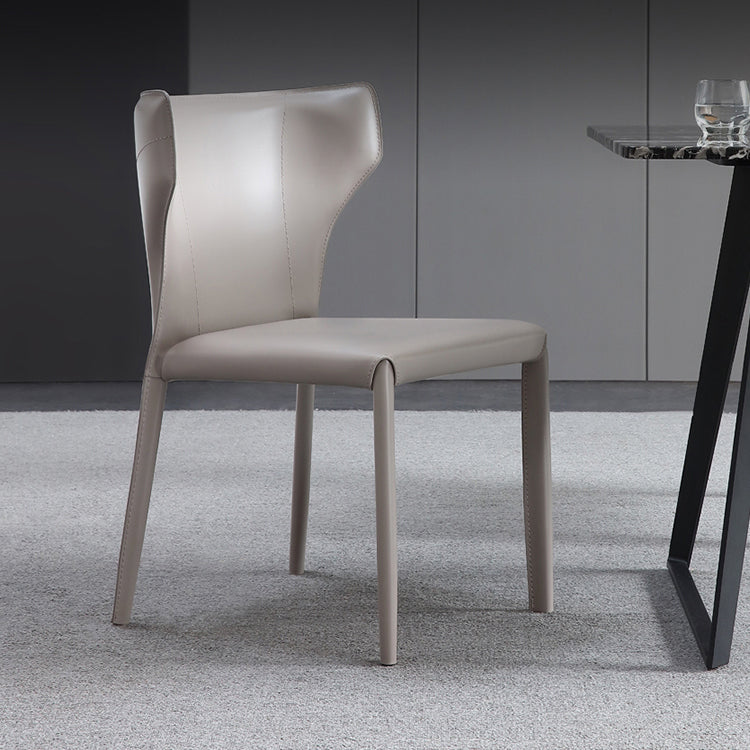 Silla lateral de comedor de cuero de estilo diseñador Silla de comedor Wingback para uso doméstico