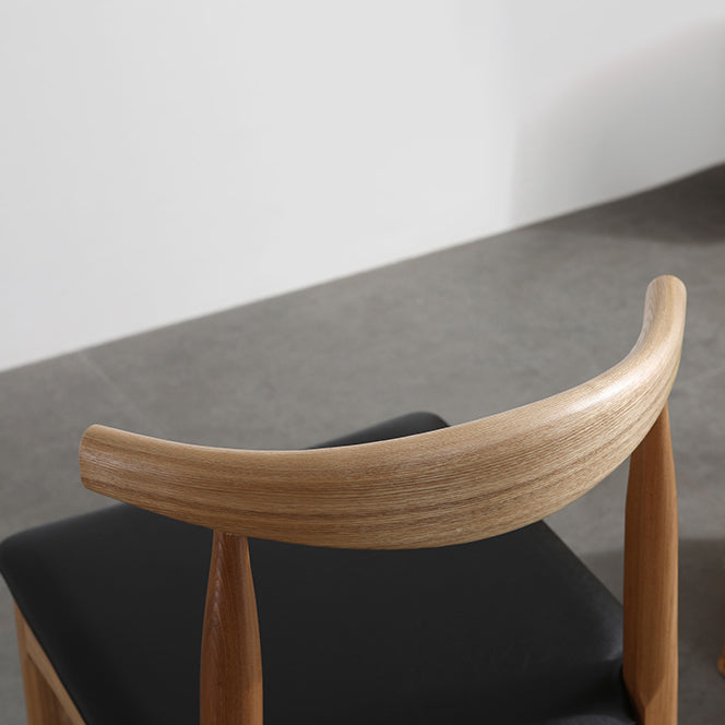 Silla lateral escandinava con respaldo abierto Silla de comedor tapizada con acabado mate