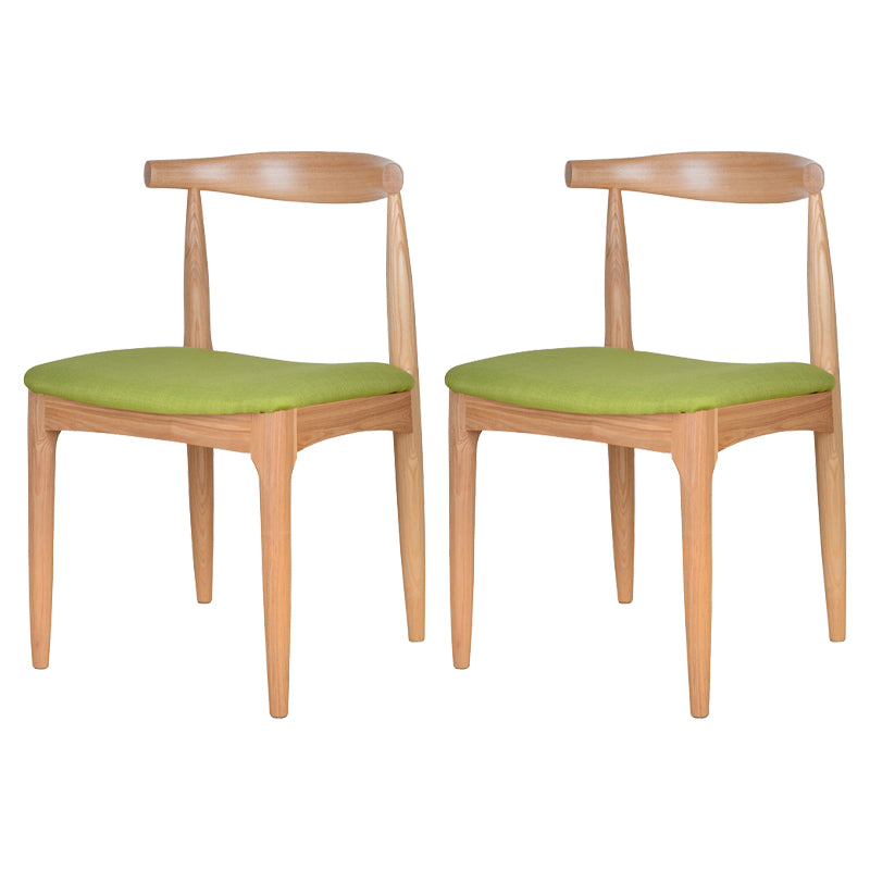 Silla lateral escandinava con respaldo abierto Silla de comedor tapizada con acabado mate