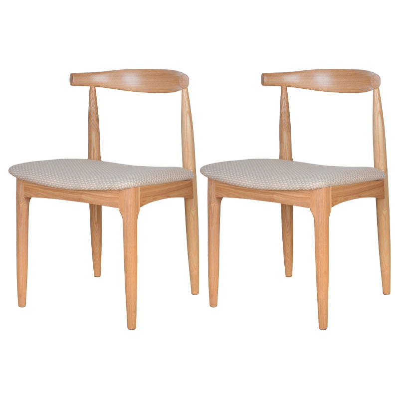 Silla lateral escandinava con respaldo abierto Silla de comedor tapizada con acabado mate
