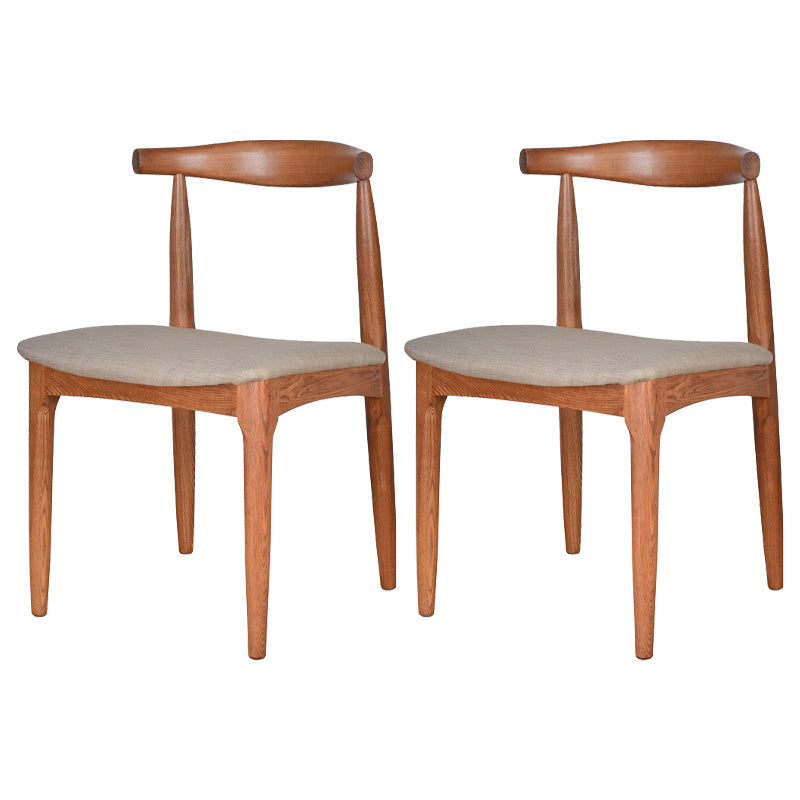 Silla lateral escandinava con respaldo abierto Silla de comedor tapizada con acabado mate