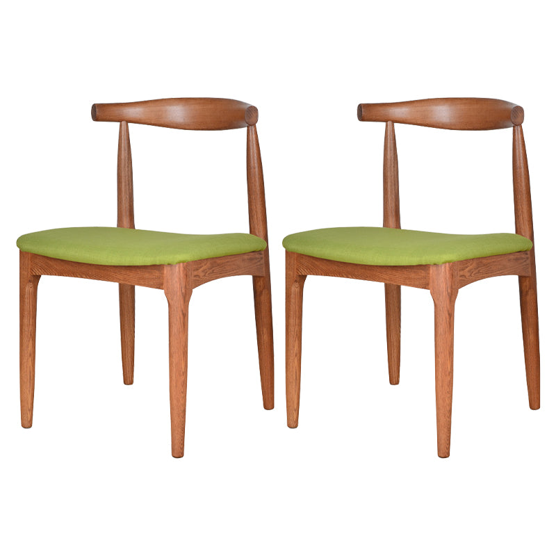 Silla lateral escandinava con respaldo abierto Silla de comedor tapizada con acabado mate