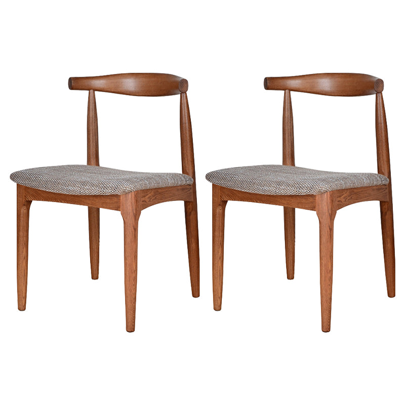 Silla lateral escandinava con respaldo abierto Silla de comedor tapizada con acabado mate