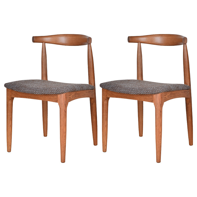 Silla lateral escandinava con respaldo abierto Silla de comedor tapizada con acabado mate
