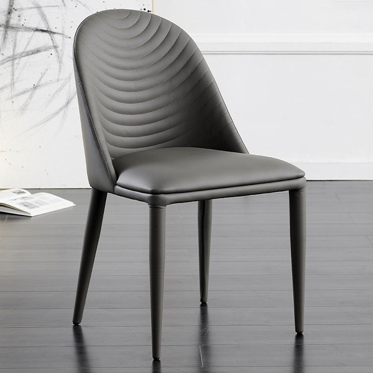 Silla sin brazos curvada de cuero moderna con acabado mate Parsons