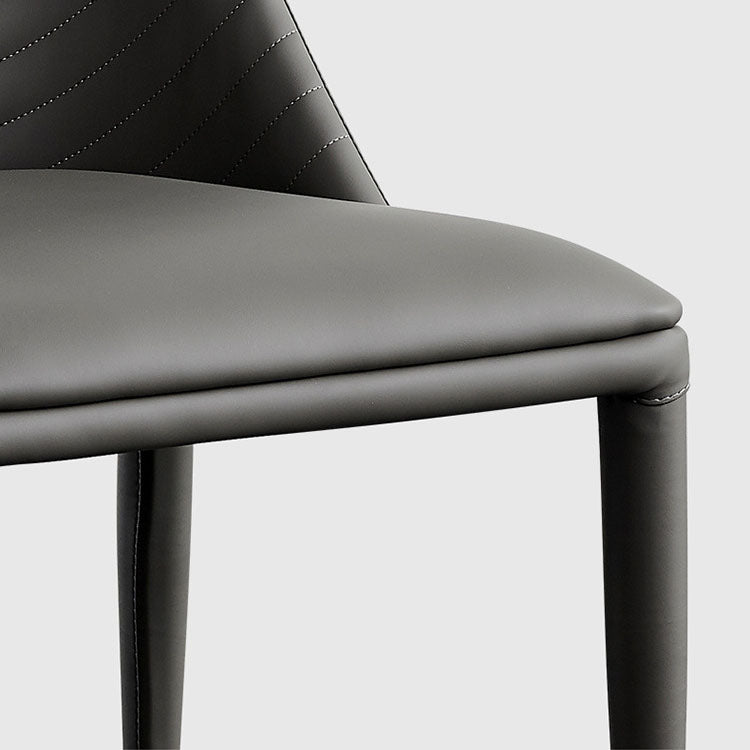 Silla sin brazos curvada de cuero moderna con acabado mate Parsons