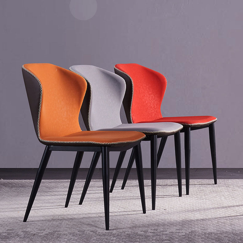 Silla lateral de cuero contemporánea para restaurante Sillas de comedor con respaldo orejero
