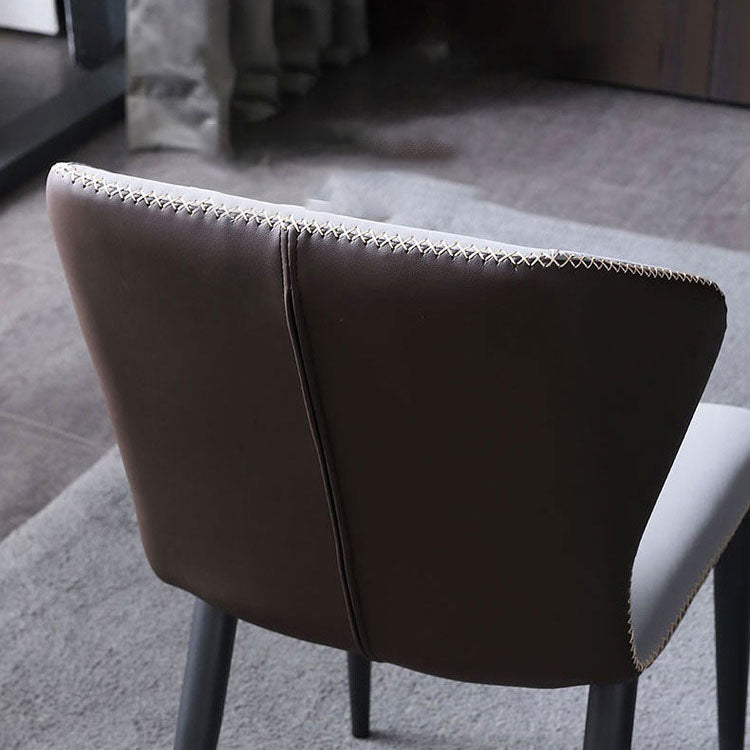 Silla lateral de cuero contemporánea para restaurante Sillas de comedor con respaldo orejero