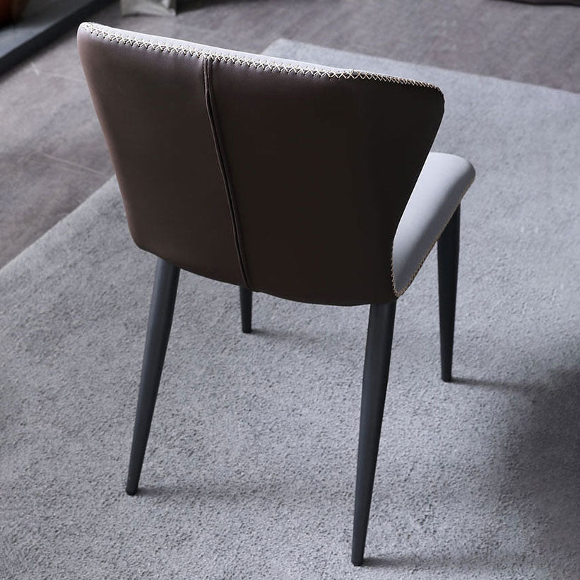Silla lateral de cuero contemporánea para restaurante Sillas de comedor con respaldo orejero