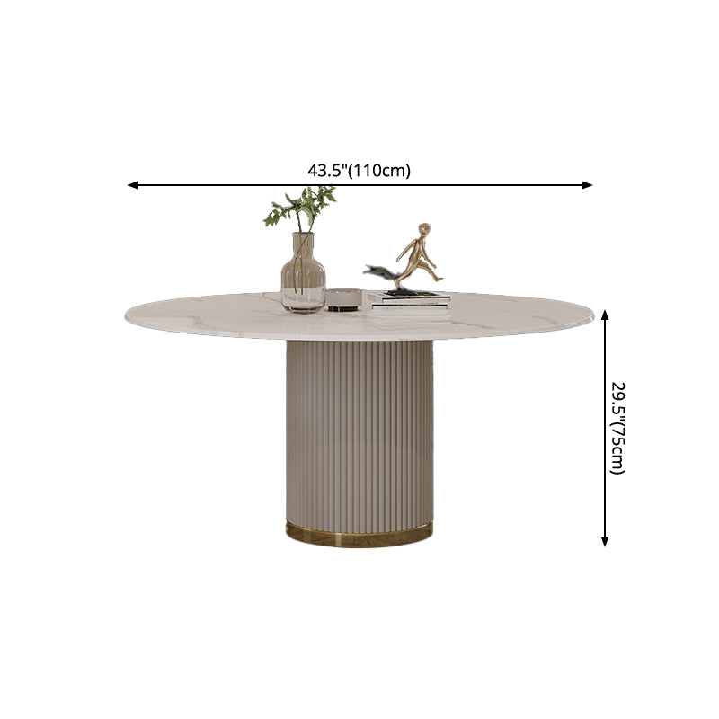 Mesa de comedor de piedra sinterizada mesa redonda de lujo con pedestal de metal en blanco