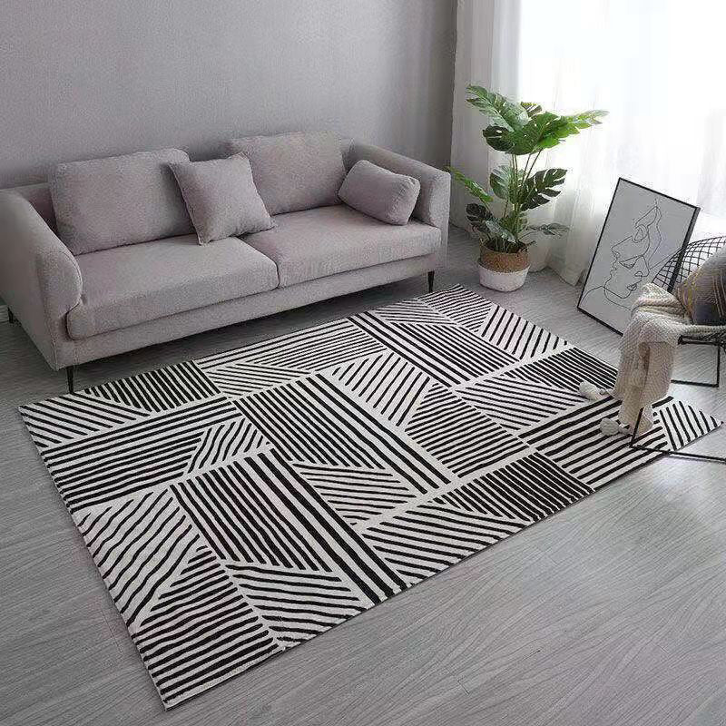 Tapis moderne gris polyester le tapis lavable à franges irréguliers pour décoration intérieure