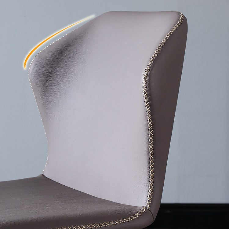 El lado sin brazos del diseño contemporáneo preside el cuero que cena la silla lateral