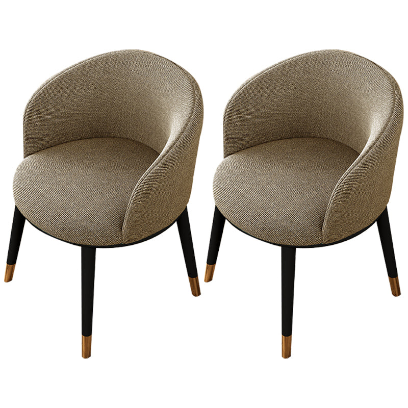 Silla de comedor tapizada moderna con respaldo sólido y acabado mate