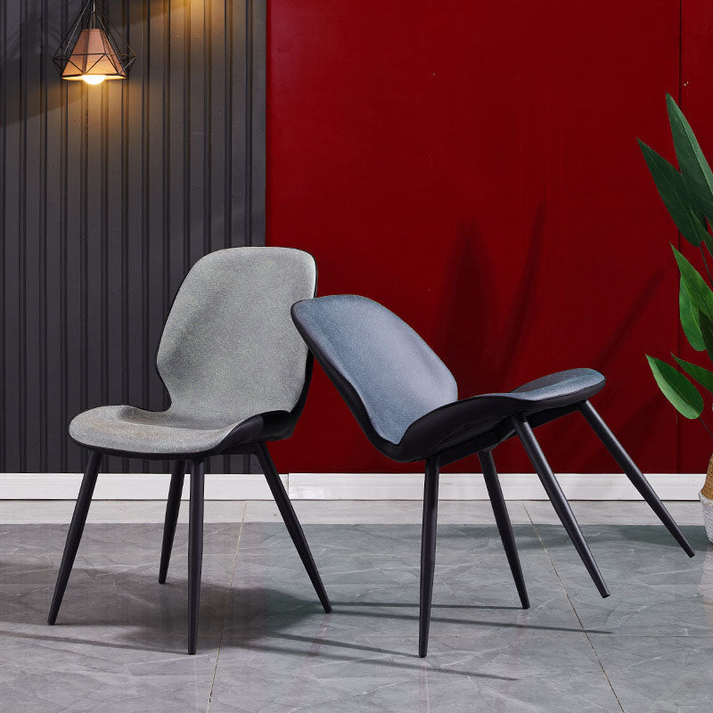 La parte posterior sólida sin brazos del diseño minimalista preside el cuero de la microfibra que cena la silla lateral