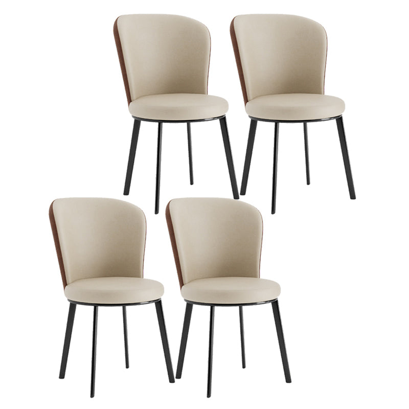 El lado contemporáneo del comedor preside la silla curvada de cuero mate de Parsons