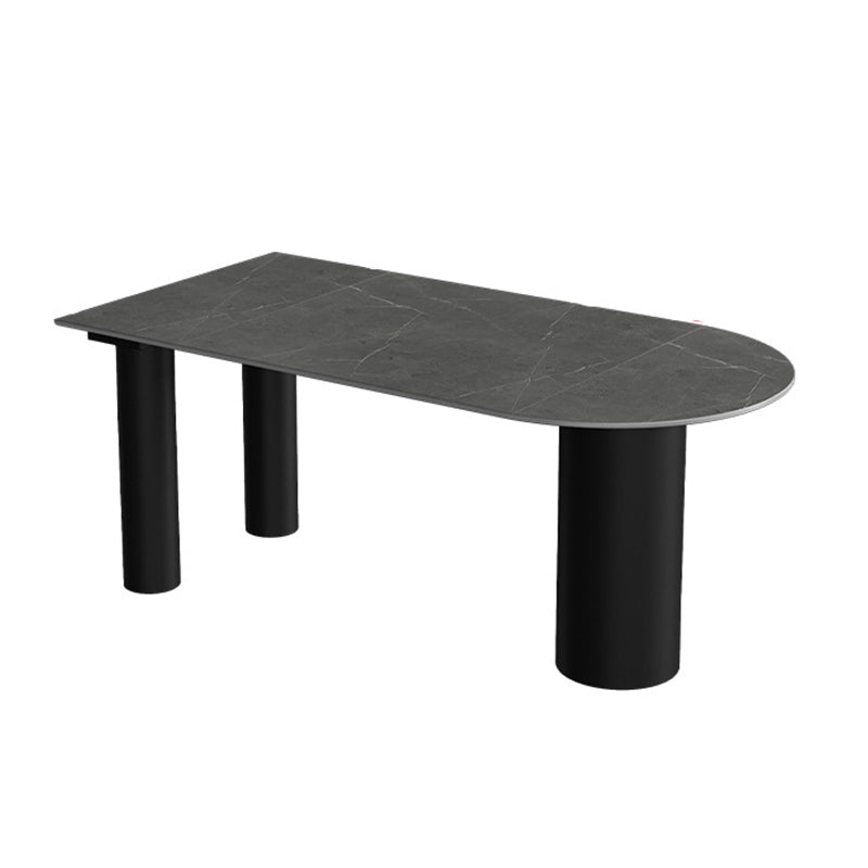 Tavolo da pranzo moderno con piano in pietra e base in acciaio nero