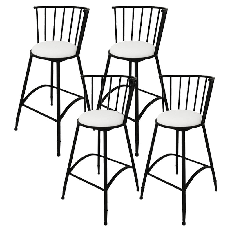Taburete de bar redondo tapizado con respaldo y reposapiés y base de hierro
