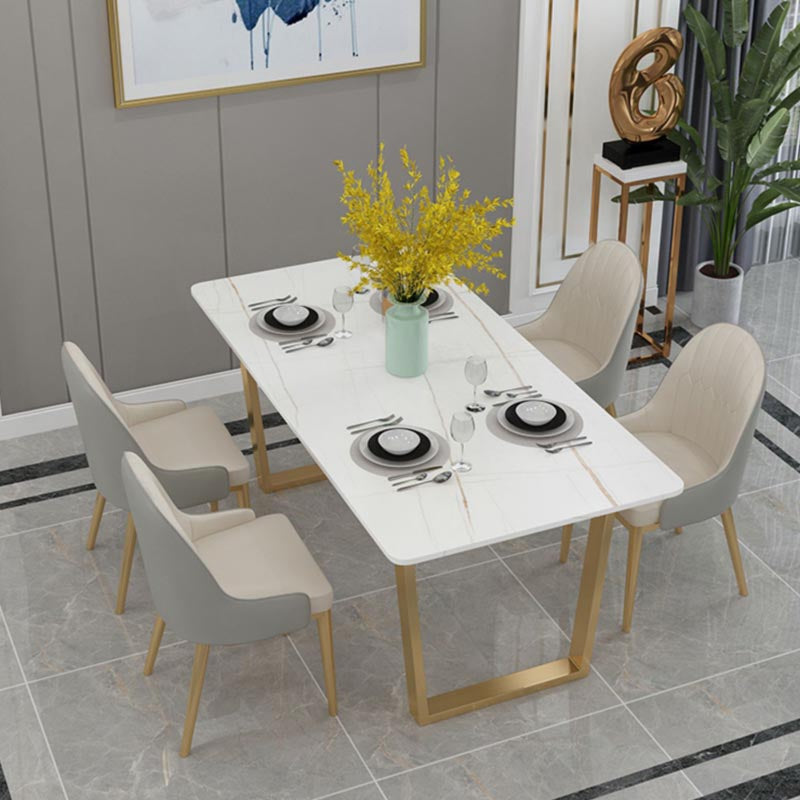 Mesa de cocina rectangular de lujo con superficie de piedra sinterizada y pedestal doble en dorado