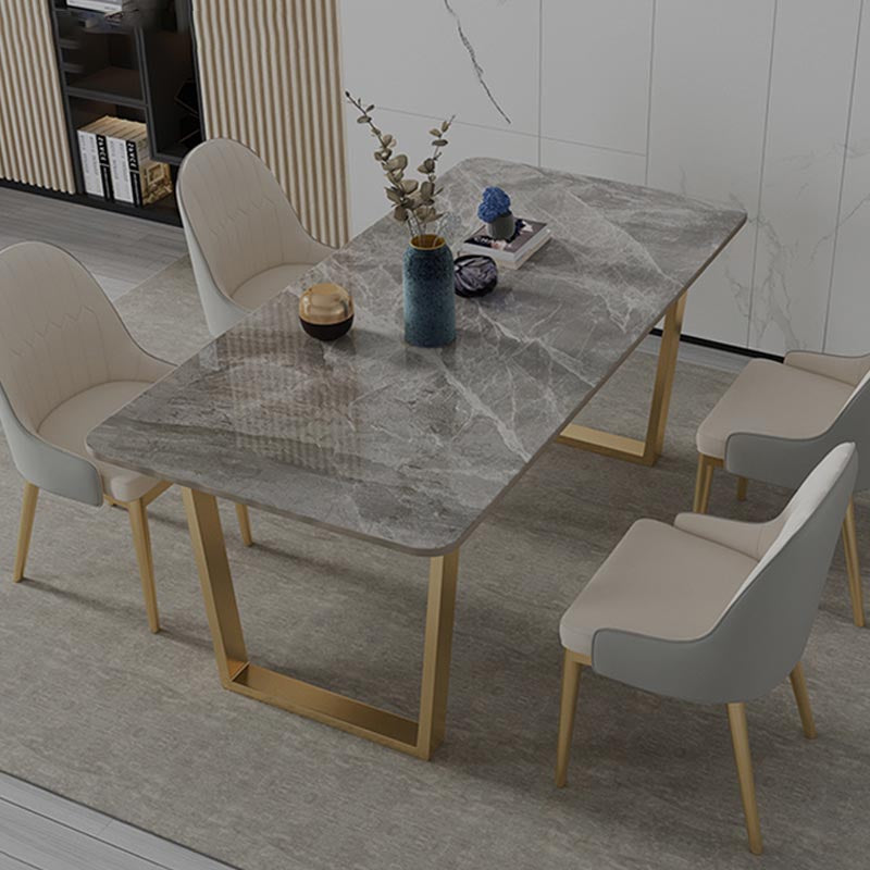 Mesa de cocina rectangular de lujo con superficie de piedra sinterizada y pedestal doble en dorado