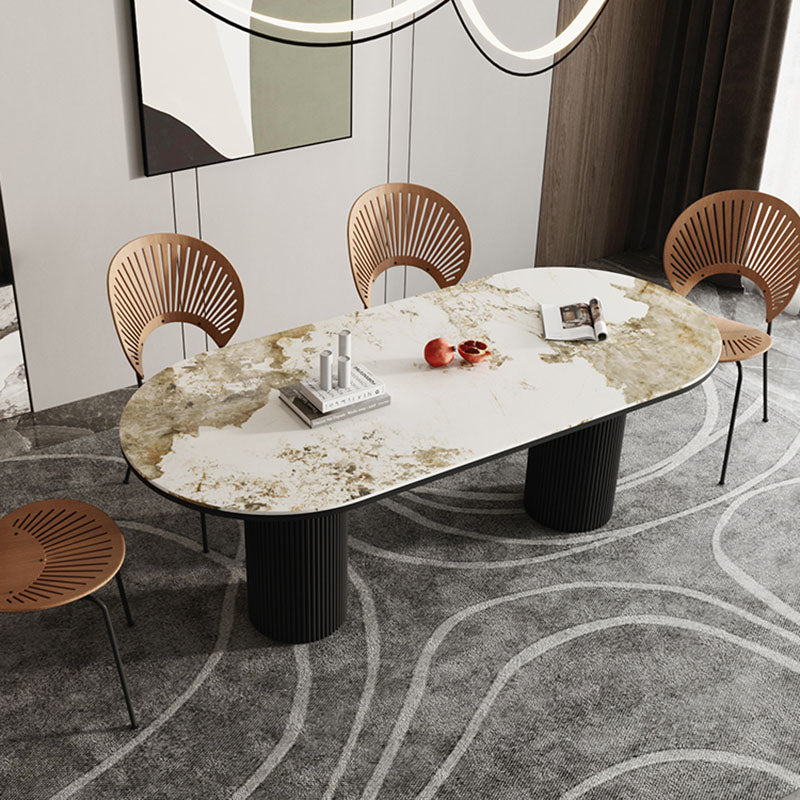Table de salle à manger ovale moderne avec dessus en pierre et double piédestal en métal