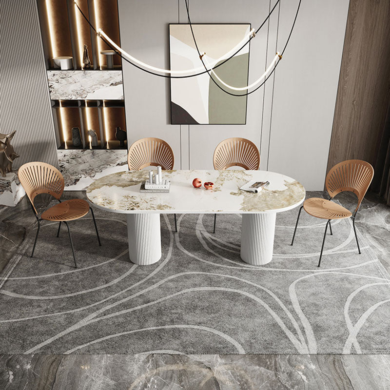 Table de salle à manger ovale moderne avec dessus en pierre et double piédestal en métal