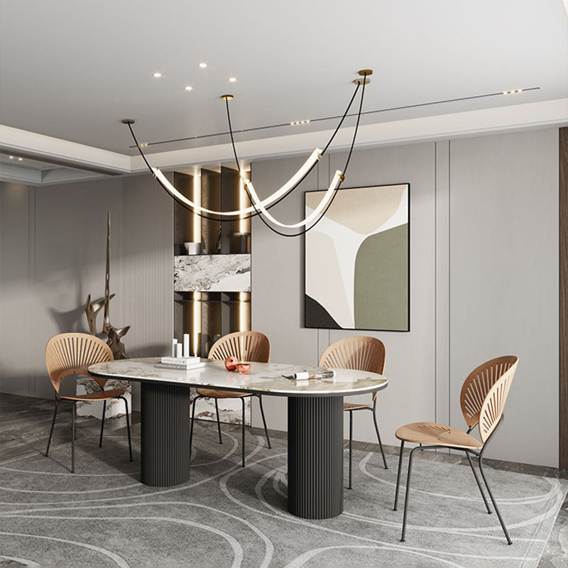 Table de salle à manger ovale moderne avec dessus en pierre et double piédestal en métal