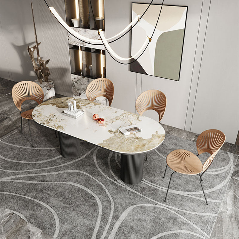 Table de salle à manger ovale moderne avec dessus en pierre et double piédestal en métal