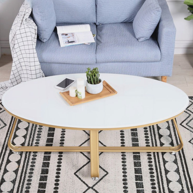 Glam Style Cocktail Table with Oval Top and Golden Iron Cross Base