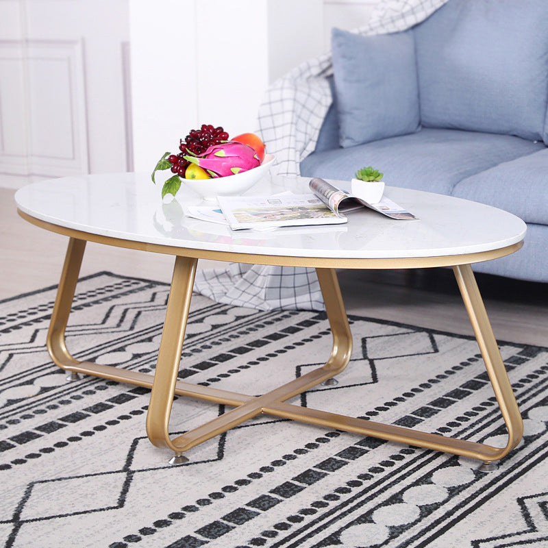 Glam Style Cocktail Table with Oval Top and Golden Iron Cross Base